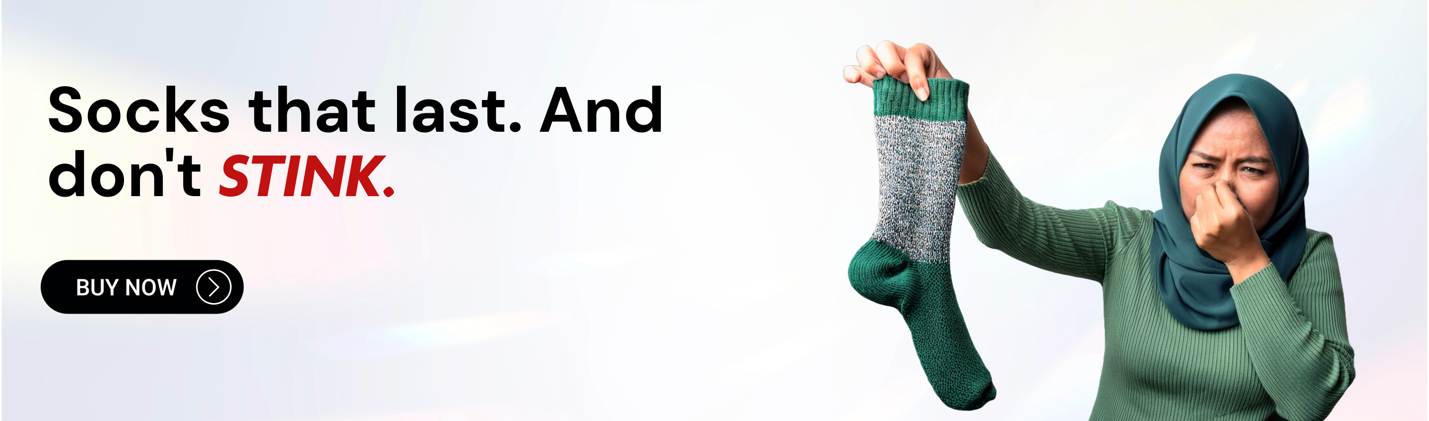 Person holding socks with text 'Socks that last. And don't STINK.' and a call to action button.